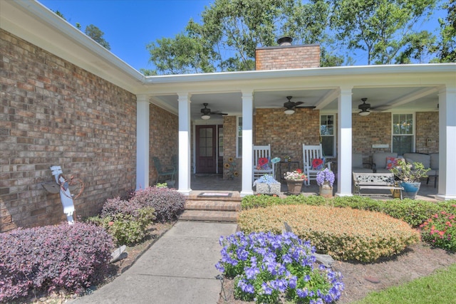 307 Candlewood Dr, Martinez, GA 30907 - view of exterior entry with ceiling fan, a chimney, covered porch, and brick siding