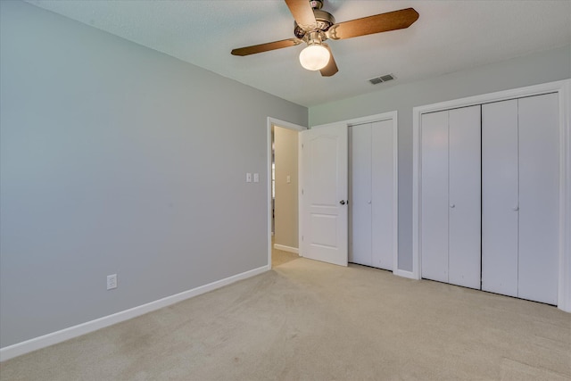 307 Candlewood Dr, Martinez, GA 30907 - unfurnished bedroom featuring two closets, carpet floors, baseboards, and a ceiling fan