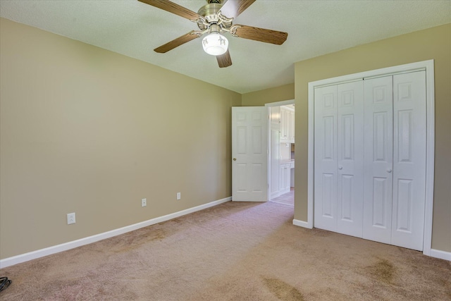 307 Candlewood Dr, Martinez, GA 30907 - unfurnished bedroom featuring light carpet, baseboards, a closet, and ceiling fan