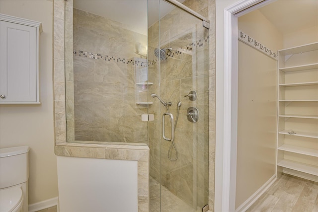 307 Candlewood Dr, Martinez, GA 30907 - full bathroom featuring toilet, a shower stall, baseboards, and wood finished floors