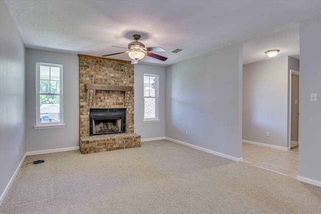 307 Candlewood Dr, Martinez, GA 30907 - unfurnished living room featuring ceiling fan, light carpet, plenty of natural light, and a fireplace