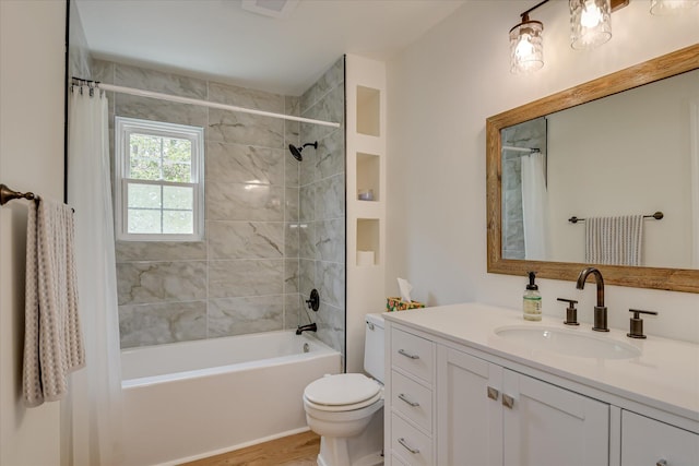 bathroom with shower / bath combo with shower curtain, vanity, toilet, and wood finished floors