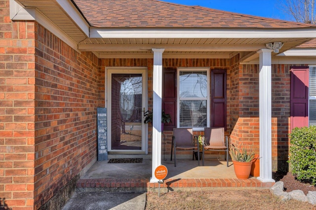 entrance to property featuring a porch