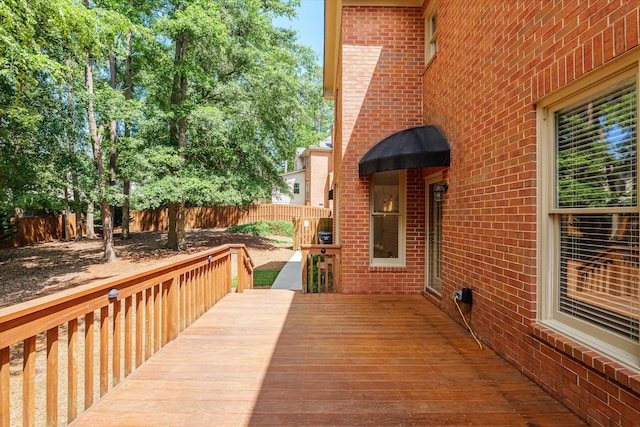 wooden deck featuring a fenced backyard