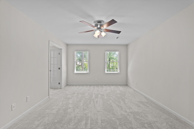 unfurnished room with ceiling fan, carpet flooring, and baseboards