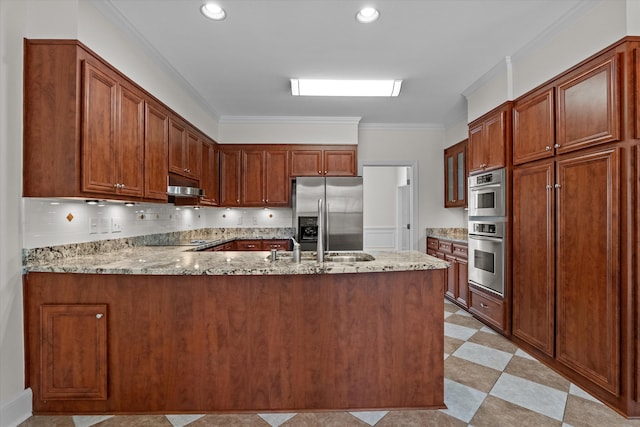 kitchen featuring stainless steel refrigerator with ice dispenser, light stone countertops, a peninsula, ornamental molding, and under cabinet range hood