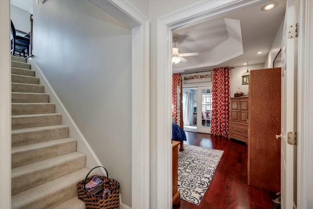 stairway featuring hardwood / wood-style flooring, recessed lighting, and a ceiling fan