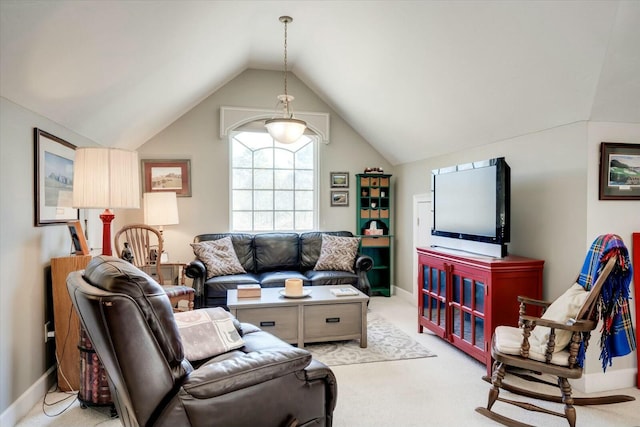 living room featuring carpet flooring, baseboards, and vaulted ceiling