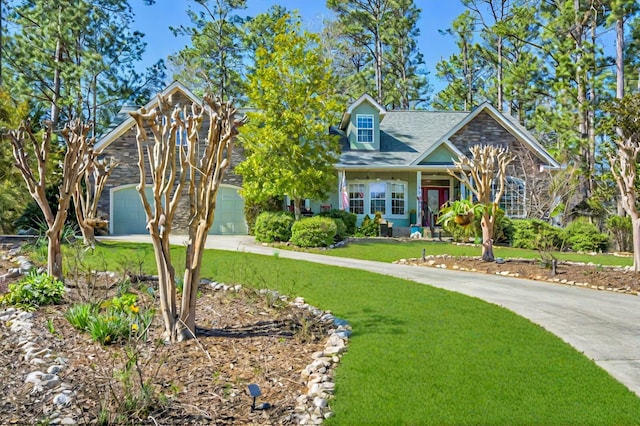 view of front of property featuring a garage, stone siding, concrete driveway, and a front lawn