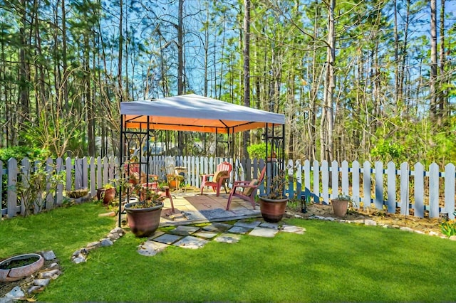 view of yard with a gazebo, a patio, and a fenced backyard