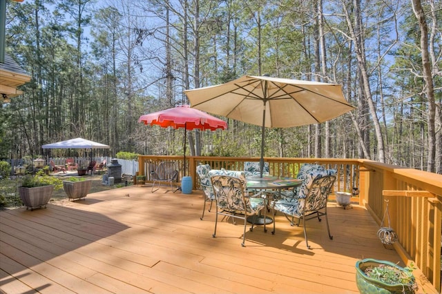 wooden deck with outdoor dining area