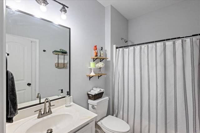 bathroom with vanity and toilet