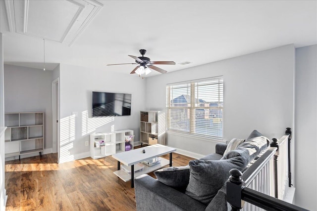 living room featuring ceiling fan and wood-type flooring