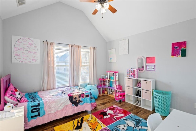 bedroom with ceiling fan, dark hardwood / wood-style floors, and lofted ceiling