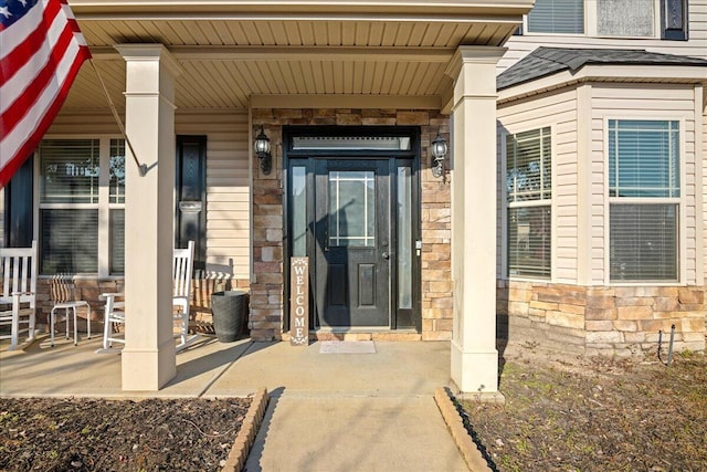 entrance to property featuring covered porch