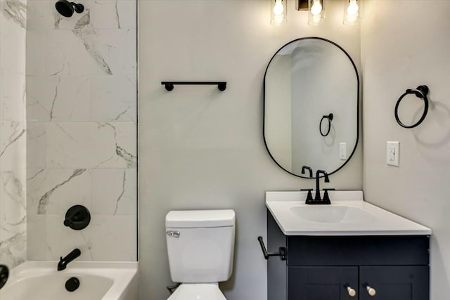 full bathroom featuring vanity, toilet, and tiled shower / bath