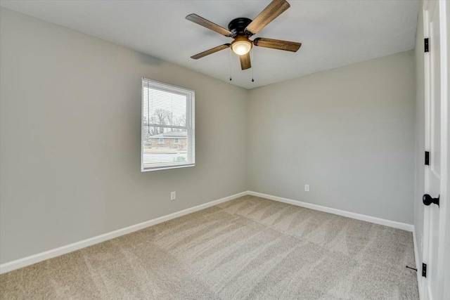 spare room with light carpet and ceiling fan