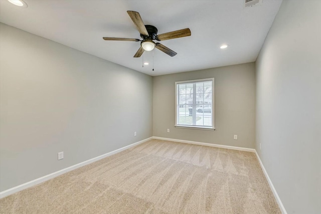 carpeted empty room with ceiling fan