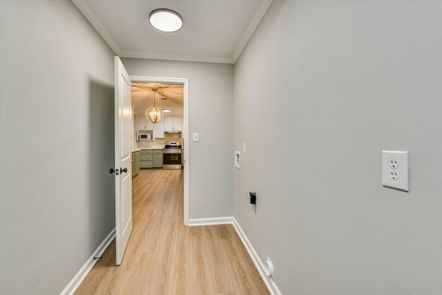 hall featuring ornamental molding and light wood-type flooring