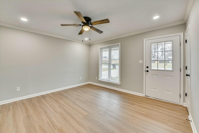 entryway featuring ornamental molding, ceiling fan, and light wood-type flooring