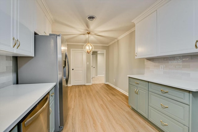 kitchen featuring light hardwood / wood-style flooring, ornamental molding, white cabinets, decorative backsplash, and stainless steel dishwasher