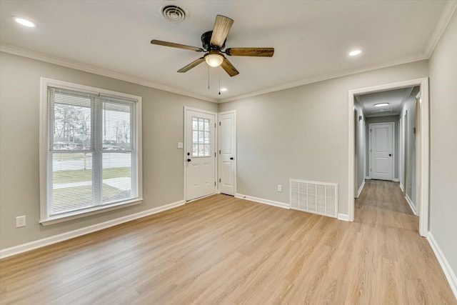 foyer entrance with crown molding, ceiling fan, and light hardwood / wood-style floors