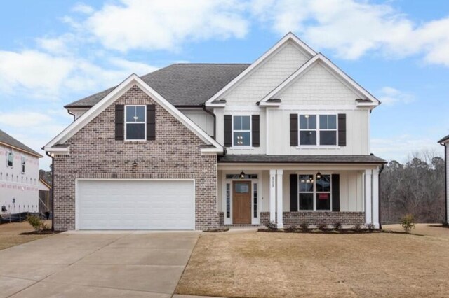 view of front facade featuring a front lawn and a garage