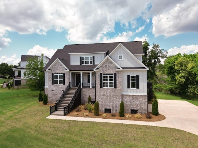 477 Rivernorth Dr, North Augusta, SC 29841 - craftsman inspired home with board and batten siding, brick siding, stairs, a front lawn, and roof with shingles