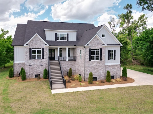 477 Rivernorth Dr, North Augusta, SC 29841 - craftsman house featuring board and batten siding, stairs, brick siding, and a front lawn