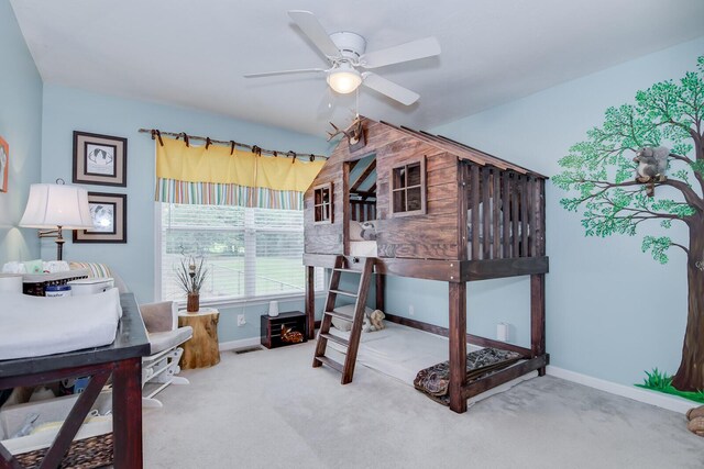 carpeted bedroom with ceiling fan and lofted ceiling