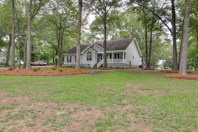 single story home with covered porch and a front lawn