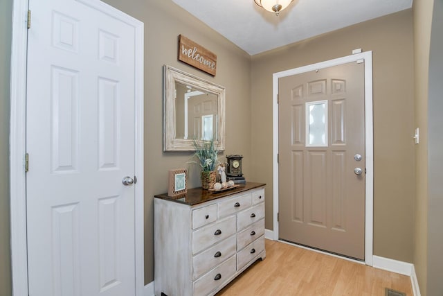 entrance foyer with light wood-type flooring