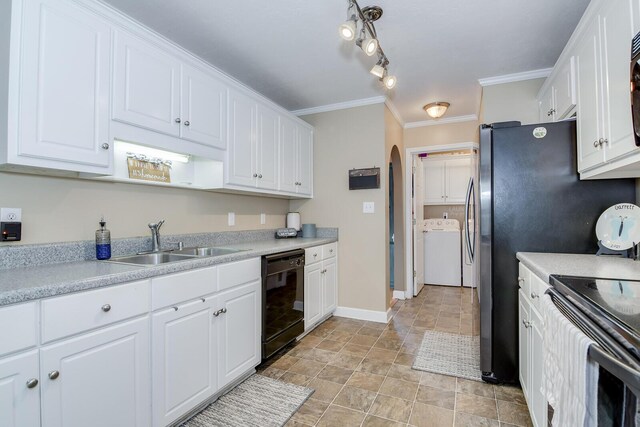 kitchen featuring washer / clothes dryer, white cabinetry, sink, and black appliances