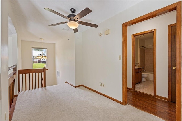 3736 Winchester Trl, Martinez, GA 30907 - empty room with a ceiling fan, a chandelier, and wood finished floors