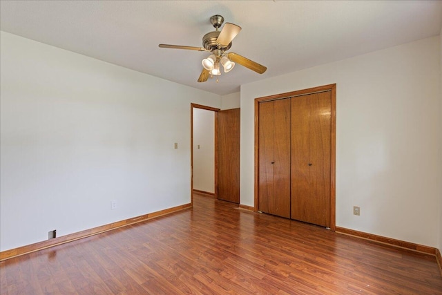 3736 Winchester Trl, Martinez, GA 30907 - unfurnished bedroom with wood finished floors, a closet, and a ceiling fan