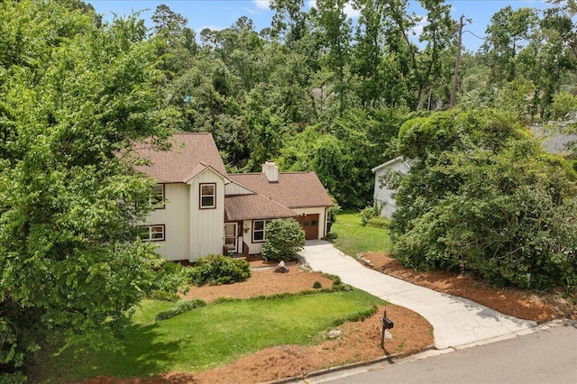 3736 Winchester Trl, Martinez, GA 30907 - view of front facade featuring roof with shingles, driveway, an attached garage, and a front yard
