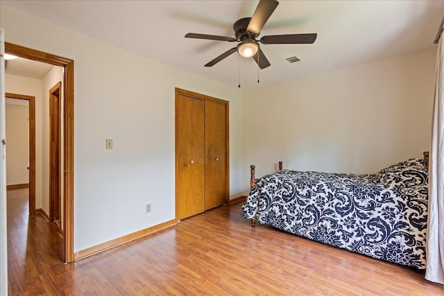3736 Winchester Trl, Martinez, GA 30907 - bedroom featuring wood finished floors, a closet, and a ceiling fan