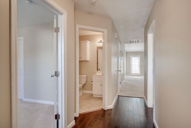 corridor featuring dark wood-type flooring