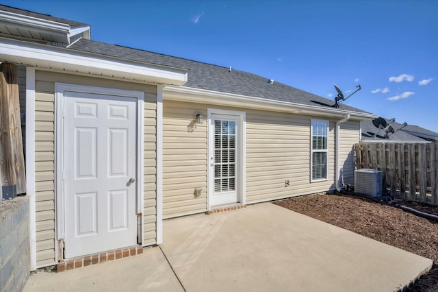 rear view of property featuring a patio and central AC unit