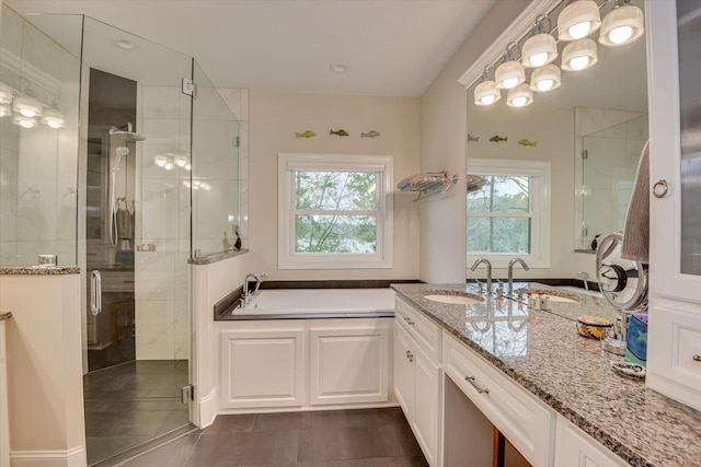 207 Rosewood Ln, Mccormick, SC 29835 - bathroom with a garden tub, a shower stall, vanity, and tile patterned floors