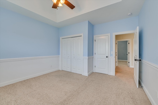 5197 Windmill Pl, Evans, GA 30809 - unfurnished bedroom with carpet, a closet, and a ceiling fan
