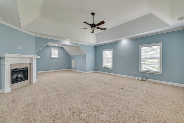 5197 Windmill Pl, Evans, GA 30809 - unfurnished living room with a tray ceiling, a ceiling fan, carpet floors, healthy amount of natural light, and lofted ceiling