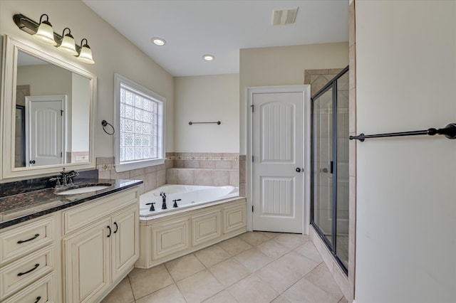 5197 Windmill Pl, Evans, GA 30809 - full bathroom with vanity, a garden tub, a stall shower, tile patterned flooring, and recessed lighting