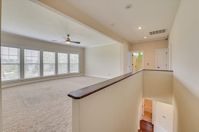5197 Windmill Pl, Evans, GA 30809 - hallway featuring an upstairs landing, dark colored carpet, crown molding, and recessed lighting