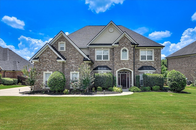 5197 Windmill Pl, Evans, GA 30809 - view of front of property with brick siding, a front yard, and a shingled roof