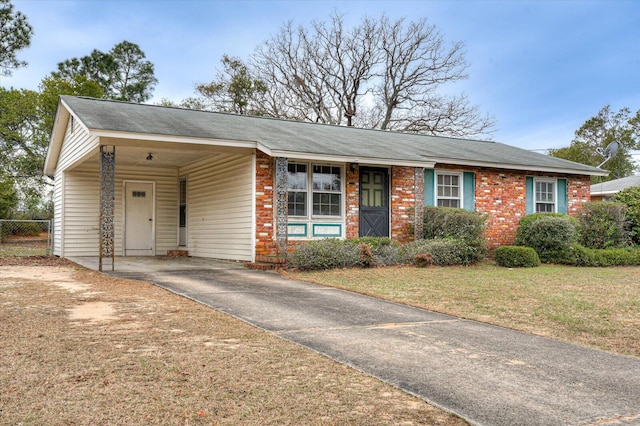 single story home featuring a carport and a front yard