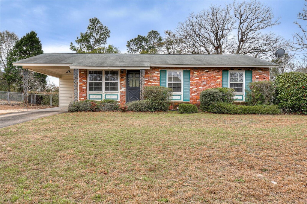 single story home featuring a front yard and a carport