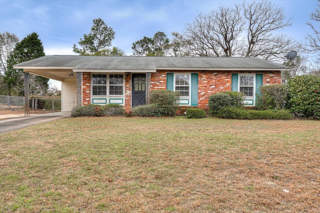 single story home featuring a front yard and a carport