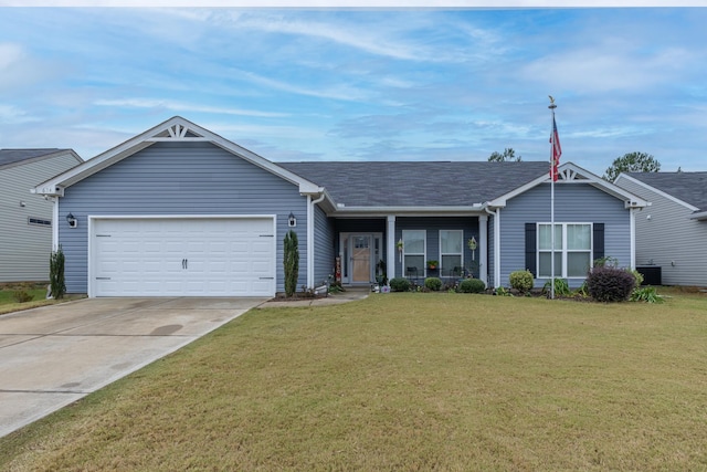 single story home with a garage and a front lawn