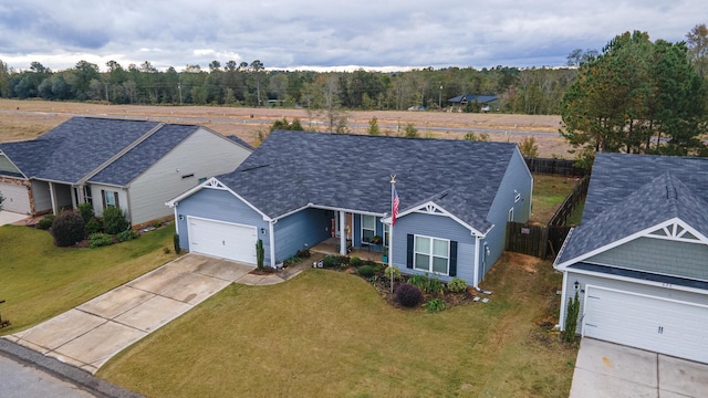 ranch-style home with a garage and a front yard